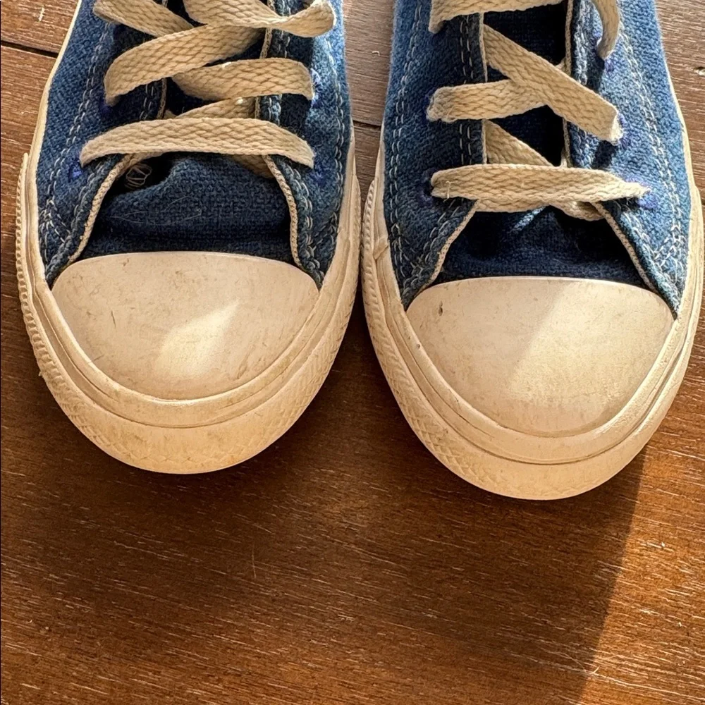 Size 2 Converse Chuck Taylor All Star Sneakers on blue